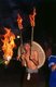 China: Miao man with fire sticks at a festival near Guiyang, Guizhou