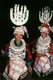 China: Young Miao women with distinctive silver headdresses offering horns of alcohol at a festival near Guiyang, Guizhou Province