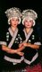 China: Young Miao women with distinctive silver headdresses at a festival near Guiyang, Guizhou Province